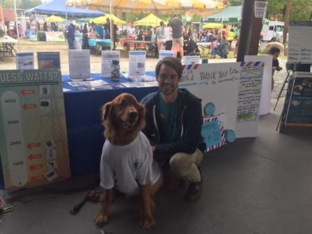 EPA Staff with dog at booth.