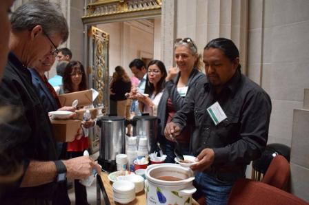 Man serving beans to attendees of the 2017 Local Foods, Local Places Summit