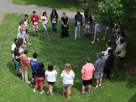 Students participate in a lesson that explores connections between ecosystems and human health.