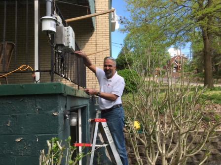 R Subramanian repairing a RAMP at an Allegheny County Clean Air Now member's house near Neville Island.