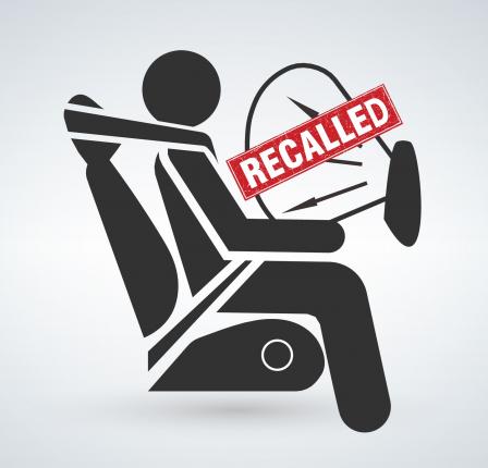 This is a drawing of a person sitting in a car with an inflated airbag with the word Recalled over the airbag.