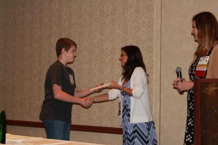 This is a picture of a student receiving an award