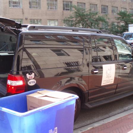 This is a picture of an SUV getting ready to be loaded up with food donations for those in need.