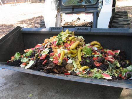 this is a picture of a front loader full of food waste