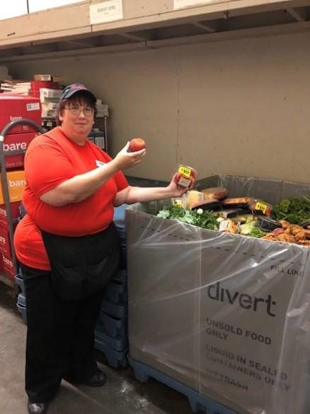 This is a picture of a GIANT Food Store worker composting