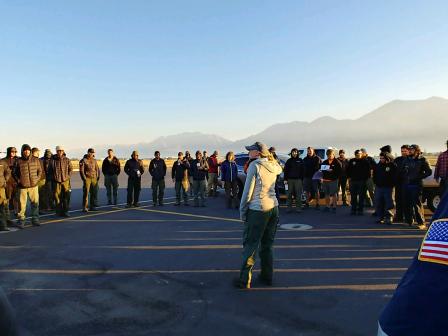 Hagler speaks to pilots about smoke conditions at a morning helibase briefing.