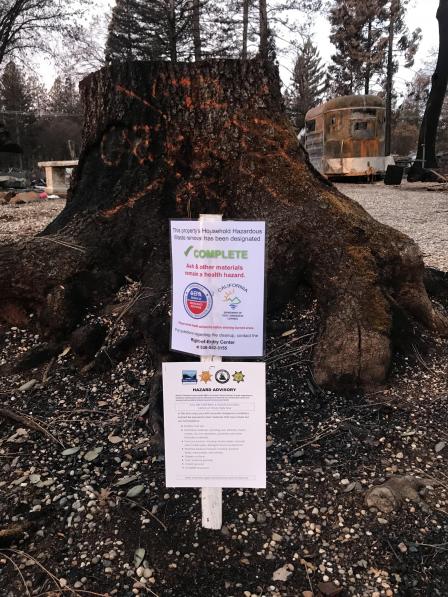 Phase 1 Completion sign and information from Butte County posted on a property.