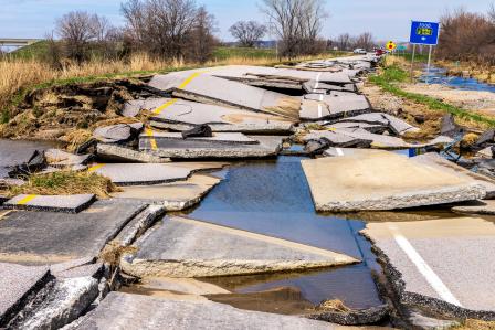 image of broken pavement from Iowa floods