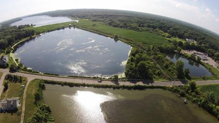 Photo of an aerial view looking northwest, showing Bear Creek wetland restoration. Photo Credit: West Michigan Shoreline Regional Development Commission