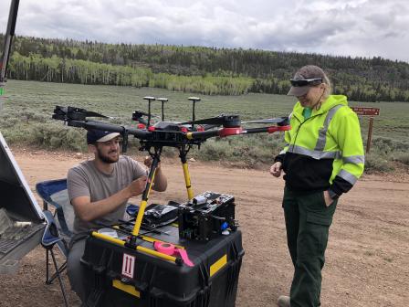 The Kolibri air sensor, a lightweight sampler developed by EPA researchers, samples chemical, particle, and biological pollutants as it is carried through smoke in an unmanned aircraft system.