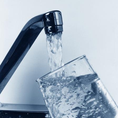 Glass being filled with water