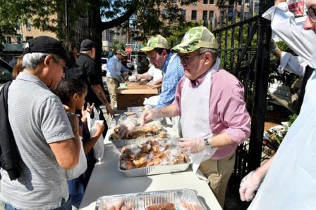 Administrator Wheeler serving food diverted from Yankees Stadium 