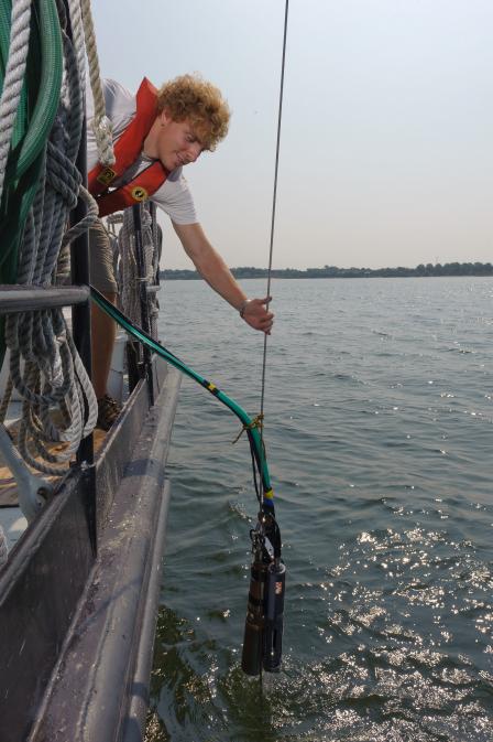 EPA scientist taking water quality measurement in Chesapeake Bay