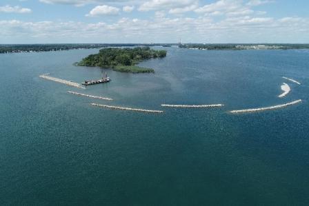 Photo of A stop-log weir was replaced with a 50'-wide opening and road bridge to reconnect the Blue Heron Lagoon and Lake Okonoka.