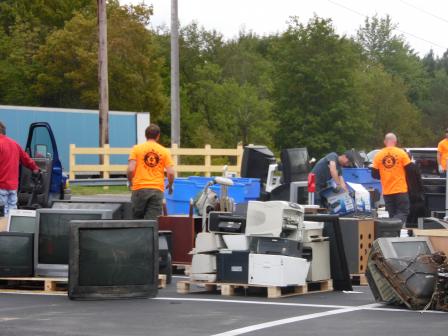 This is a picture of people managing electronics waste