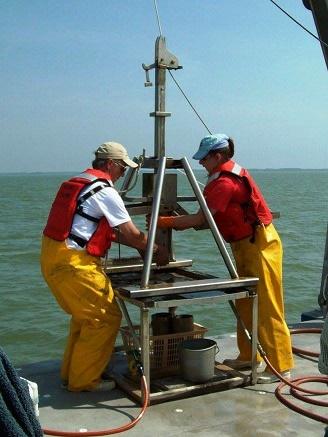 Tammy with Walter Boynton collecting sediment cores to assess the health of the Chesapeake Bay.
