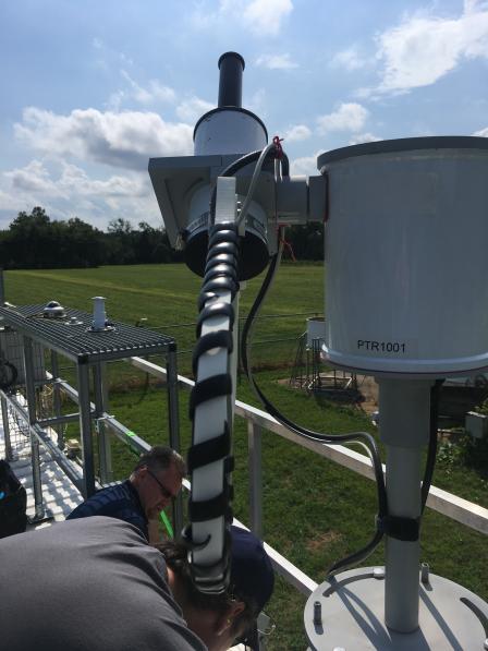 EPA scientists David Williams and Jim Szykman set up a ground-based Pandora spectrometer for satellite validation on the New Jersey Department of Environmental Protection air quality monitoring site at Rutgers University in New Brunswick, NJ.   