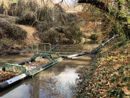 Bandalong Litter Trap hard at work, cleaning Proctor Creek. Photo courtesy of Storm Water Systems, Inc.