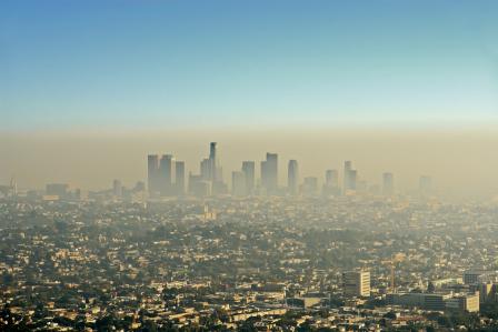 A city skyline enveloped by smog