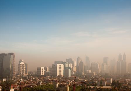 A city skyline with smog