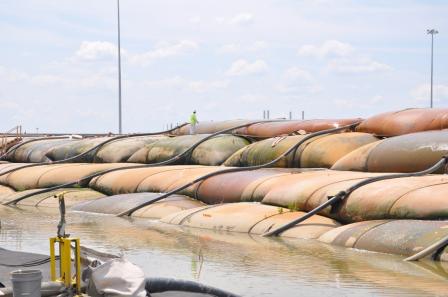 photo of Geotubes, large lined bags that allow for water to exit but keep sediment contained after hydraulic dredging, filled with contaminated sediments from the Ottawa River. Photo credit: Ohio EPA