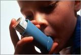 Child using an inhaler.