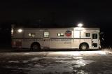 a long white bus with the EPA Emergencey Response logo