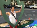 Katherine Antos with the parking day display in front of a canoe