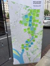 a banner with a map of the Anacostia River with post its on it saying what people want for the River