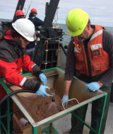 Scientists sifting the finer materials out of the Ponar grab sample