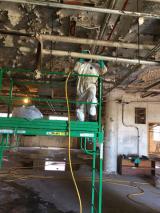 Technician places glove-bag over asbestos-contaminated material. 