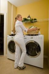 Image of a woman in a laundry room.