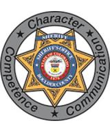 This is the shield of the Boulder County Sheriff's office that has the words Character, Competence and Communication on it surrounding a gold six pointed star