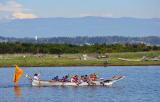 Native Americans rowing a boat