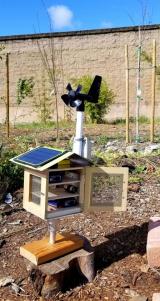 An educational air quality monitoring device designed to look like a birdhouse and powered by solar panels.