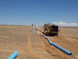 Installing water infrastructure pipe on the Navajo Nation.