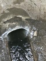 View of the cured sanitary sewer liner at the man hole located on the Electro Plating Services property