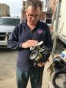 EPA On-Scene Coordinator Kevin Turner cleans his respirator after inspecting a building.
